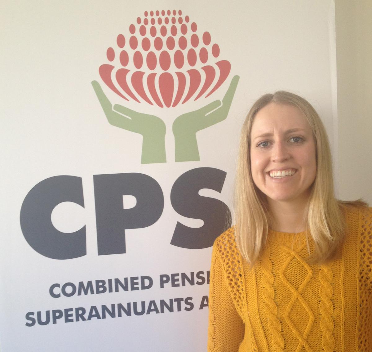 Amelia stand in front of CPSA sign