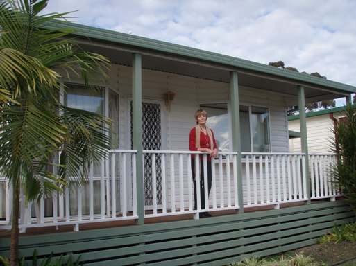 Jill Edmonds standing in front of her home