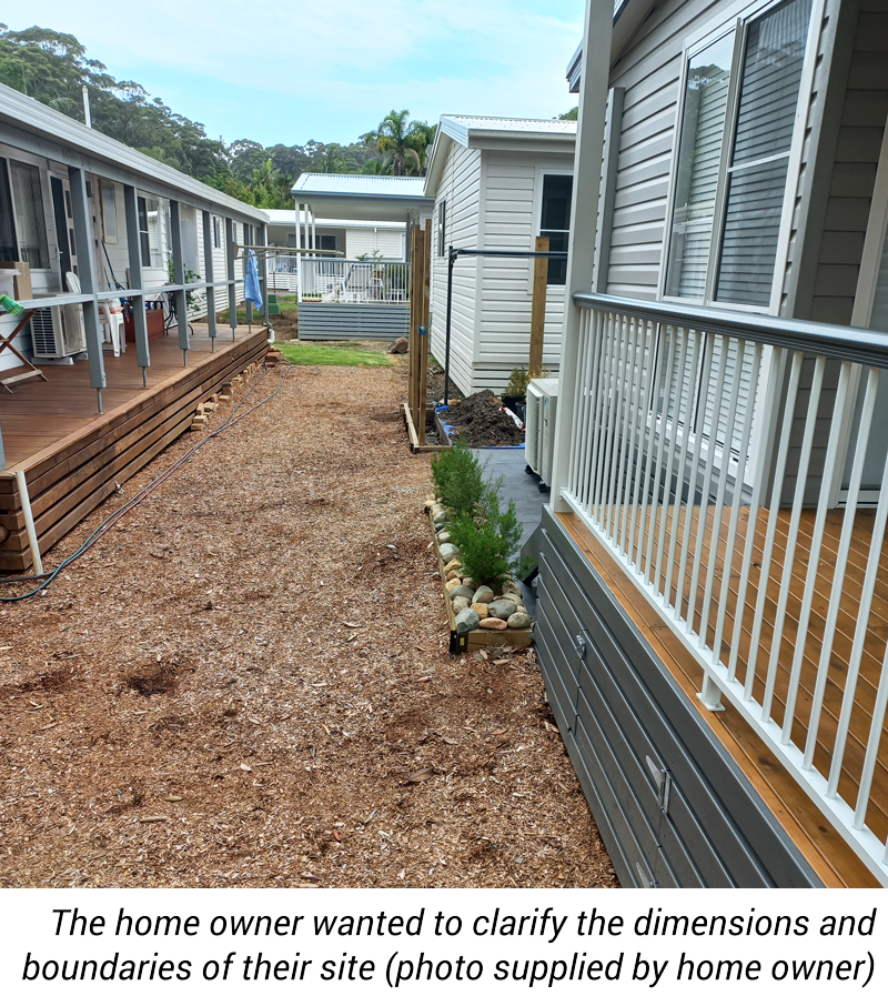A photo showing homes and a path in between them